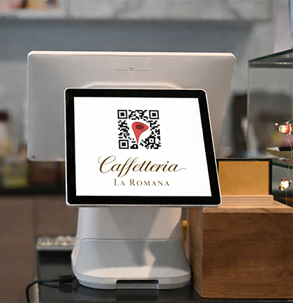 QR Code posizionato vicino al registratore di cassa per recensioni